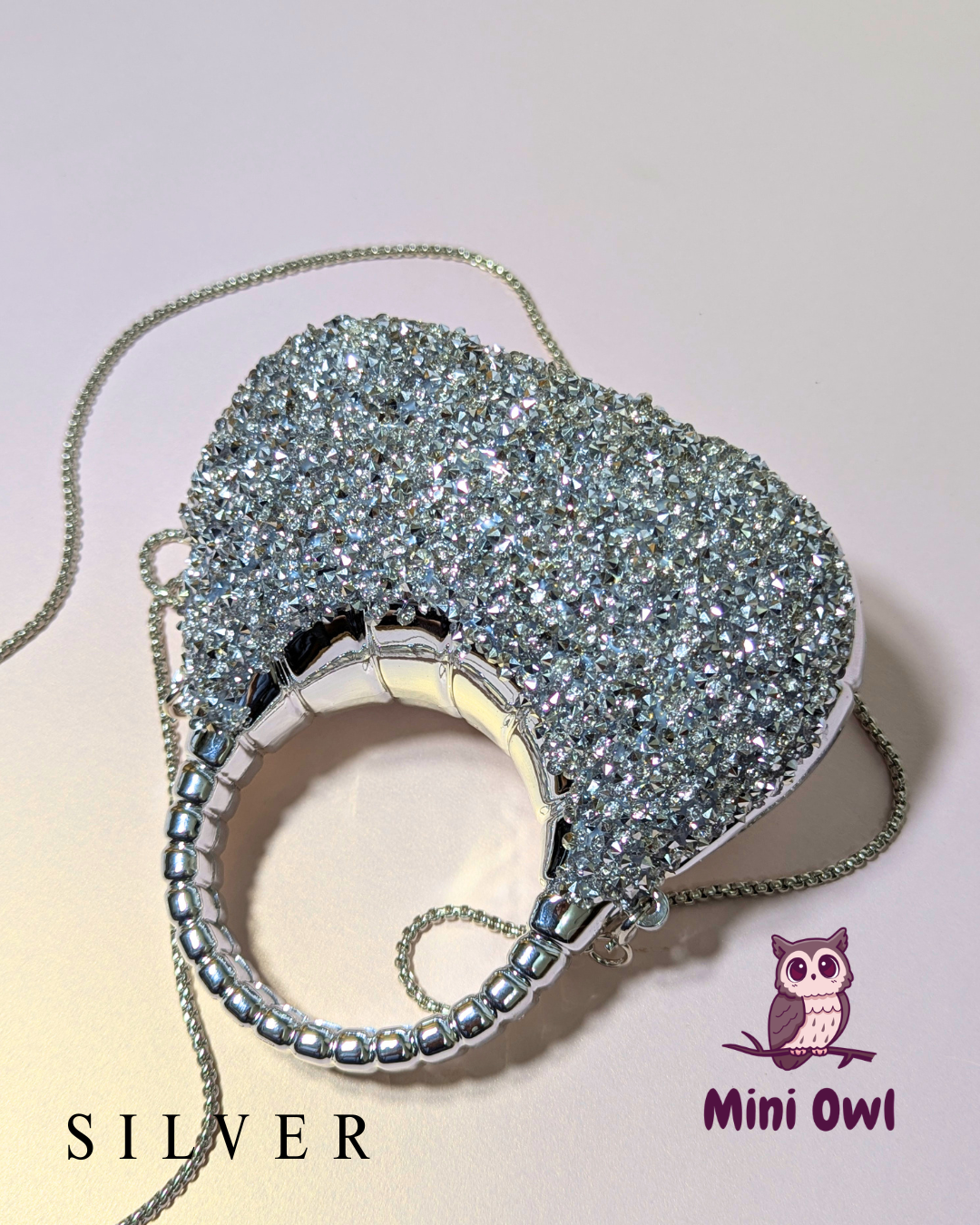 Rhinestone-encrusted acrylic mini clutch