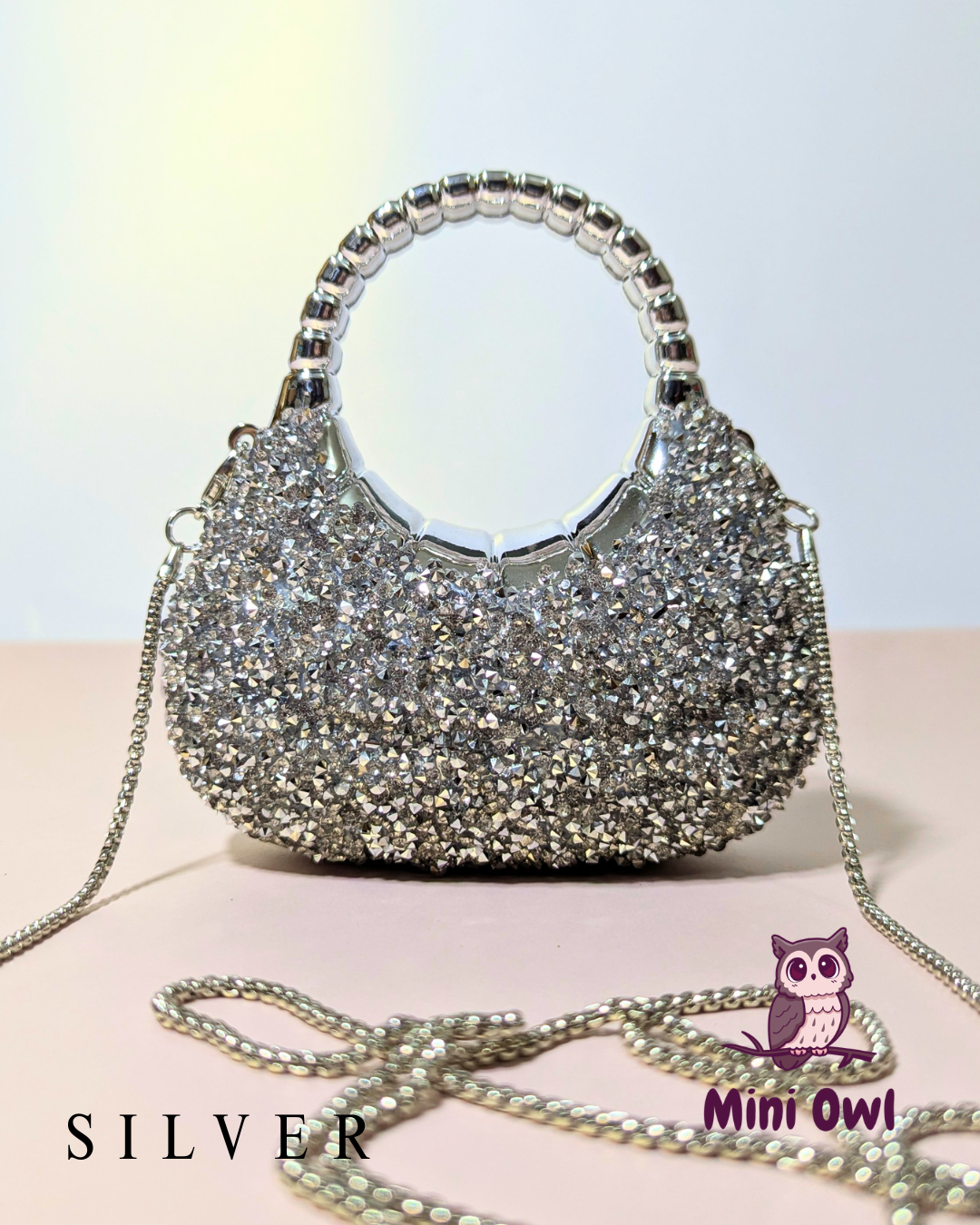 Rhinestone-encrusted acrylic mini clutch